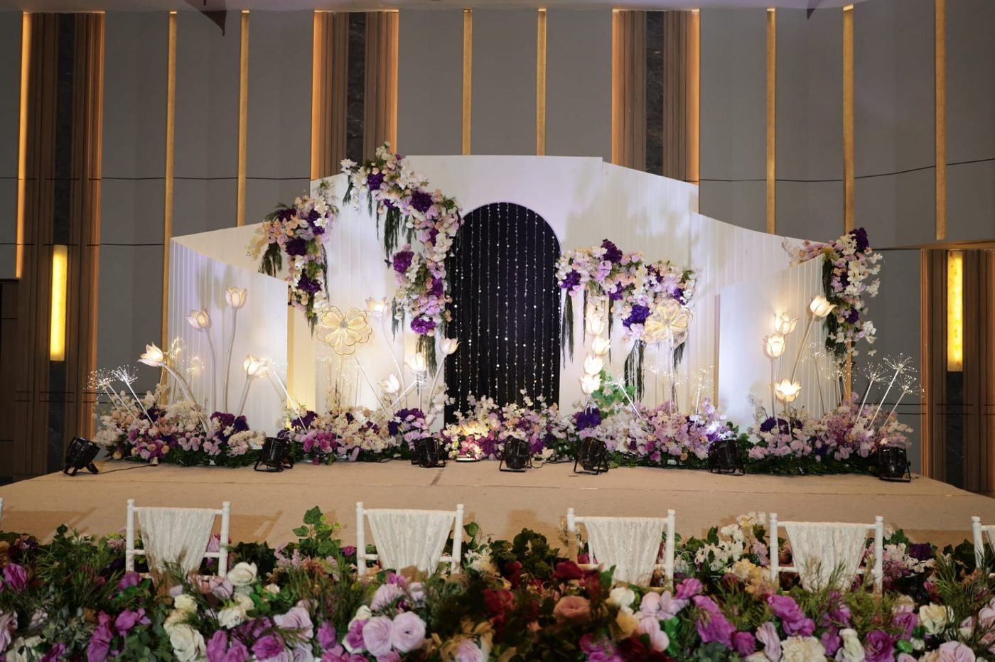 Lilac and white floral arch doorway with illuminated tulip lights